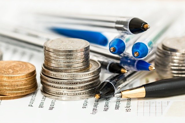 coins and pens - working out tax savings