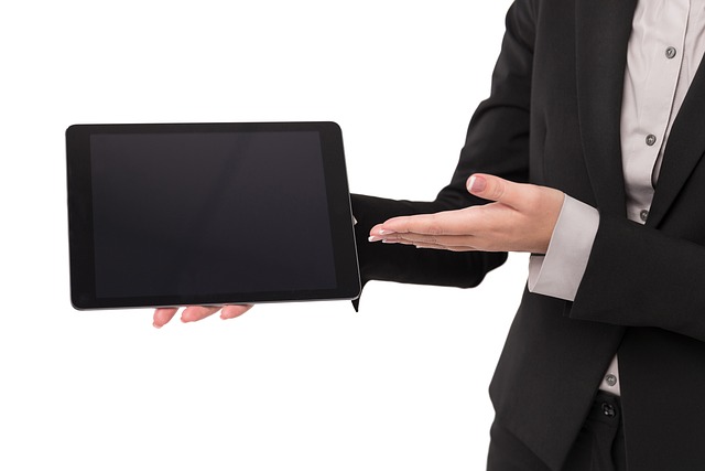 busienss woman presenting on a tablet