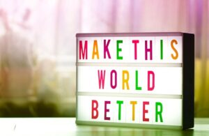 sign saying 'make this world better'